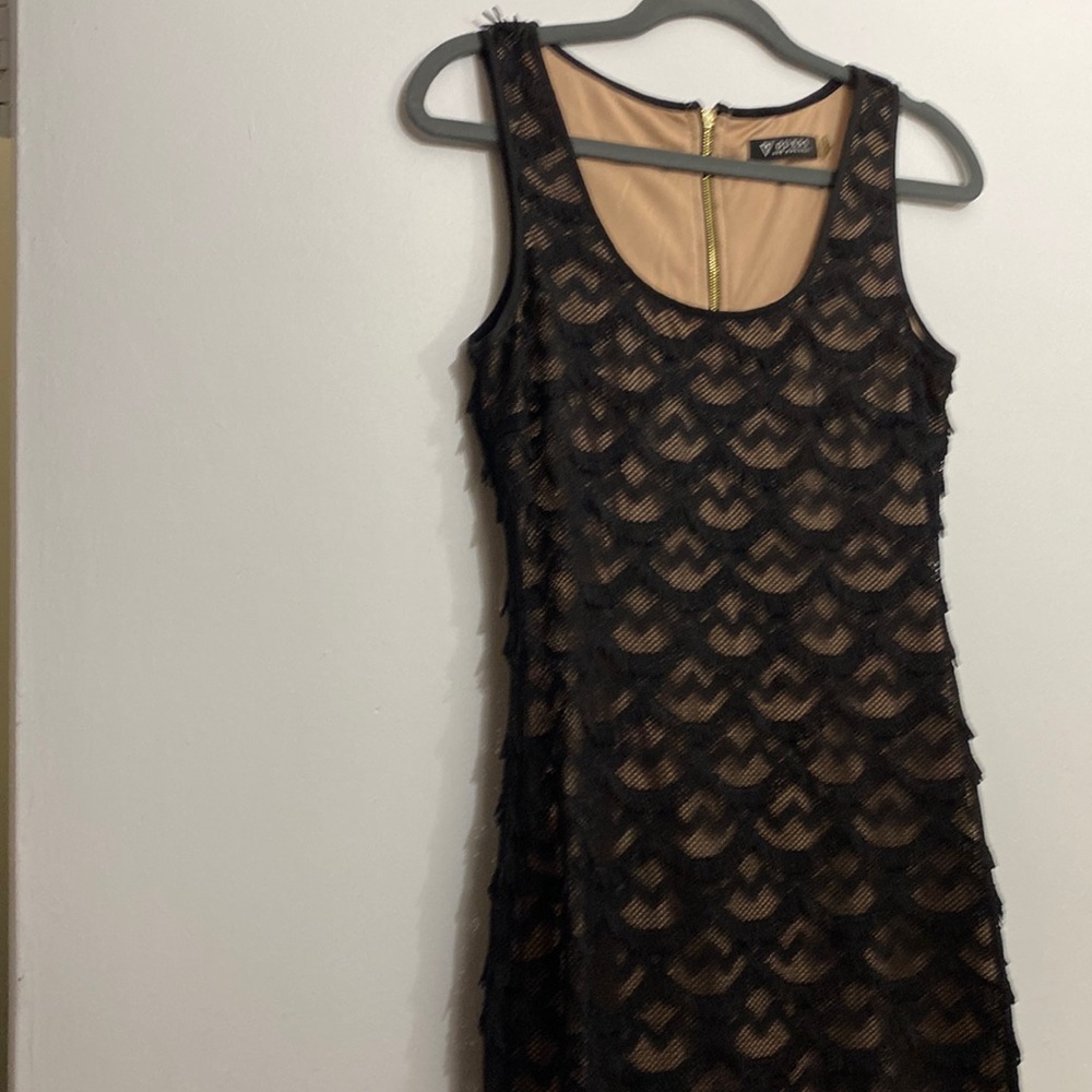 Guess, size 4, Black fringe with nude lining.